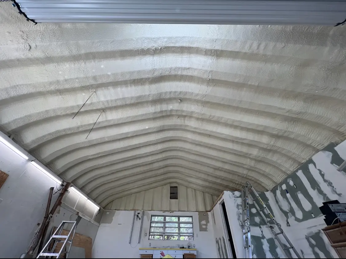 Spray polyurethane foam applied to the underside of a metal roof deck in Bourbonnais